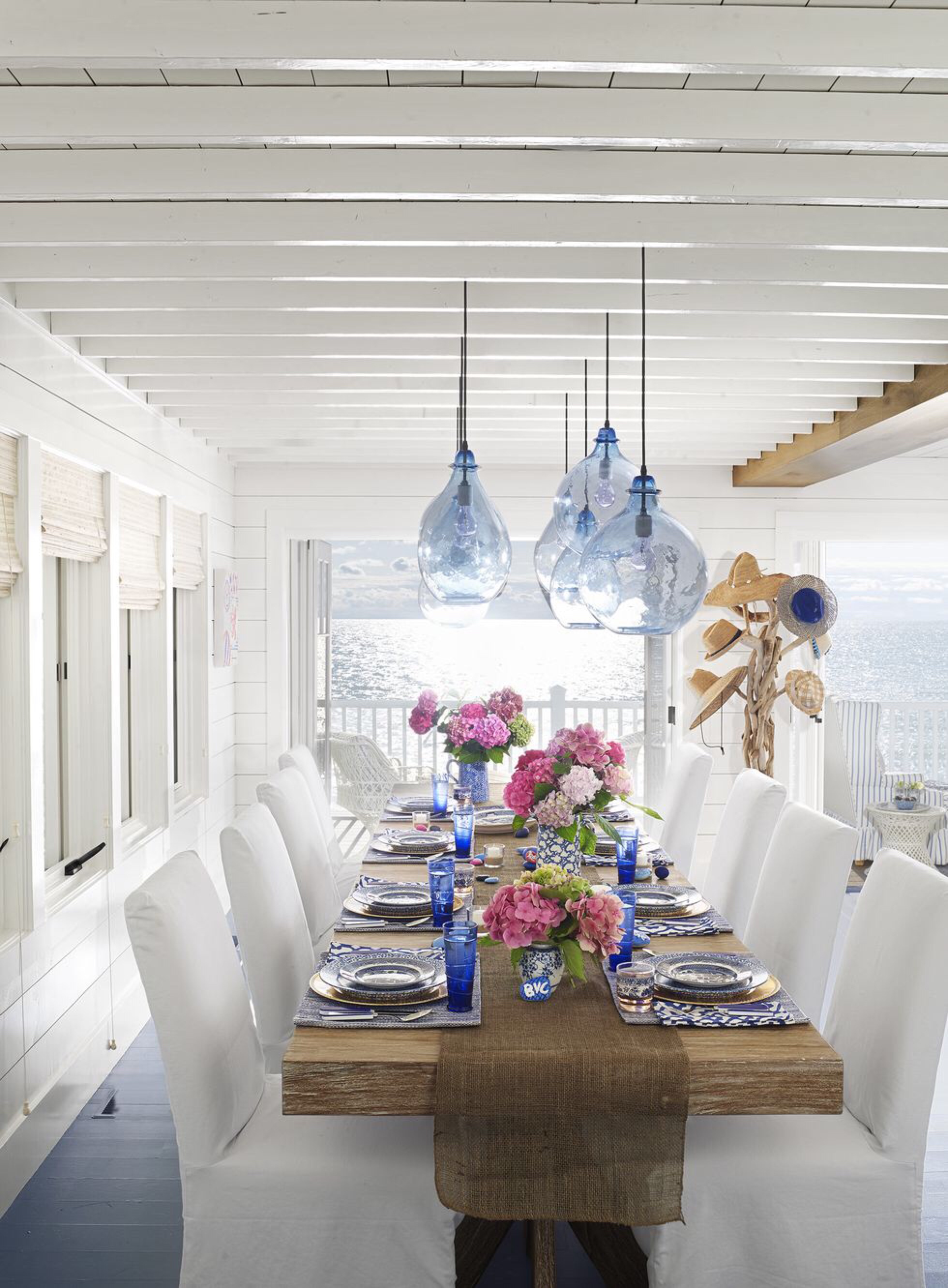 dinner_dining_table_dining_room_lights_Article_from_House_Beautiful_summer_home_in_Ludington_Michigan_decor_decoration_blue_white_beach_decor_interiors_and_more_vacations_980_1332.jpg